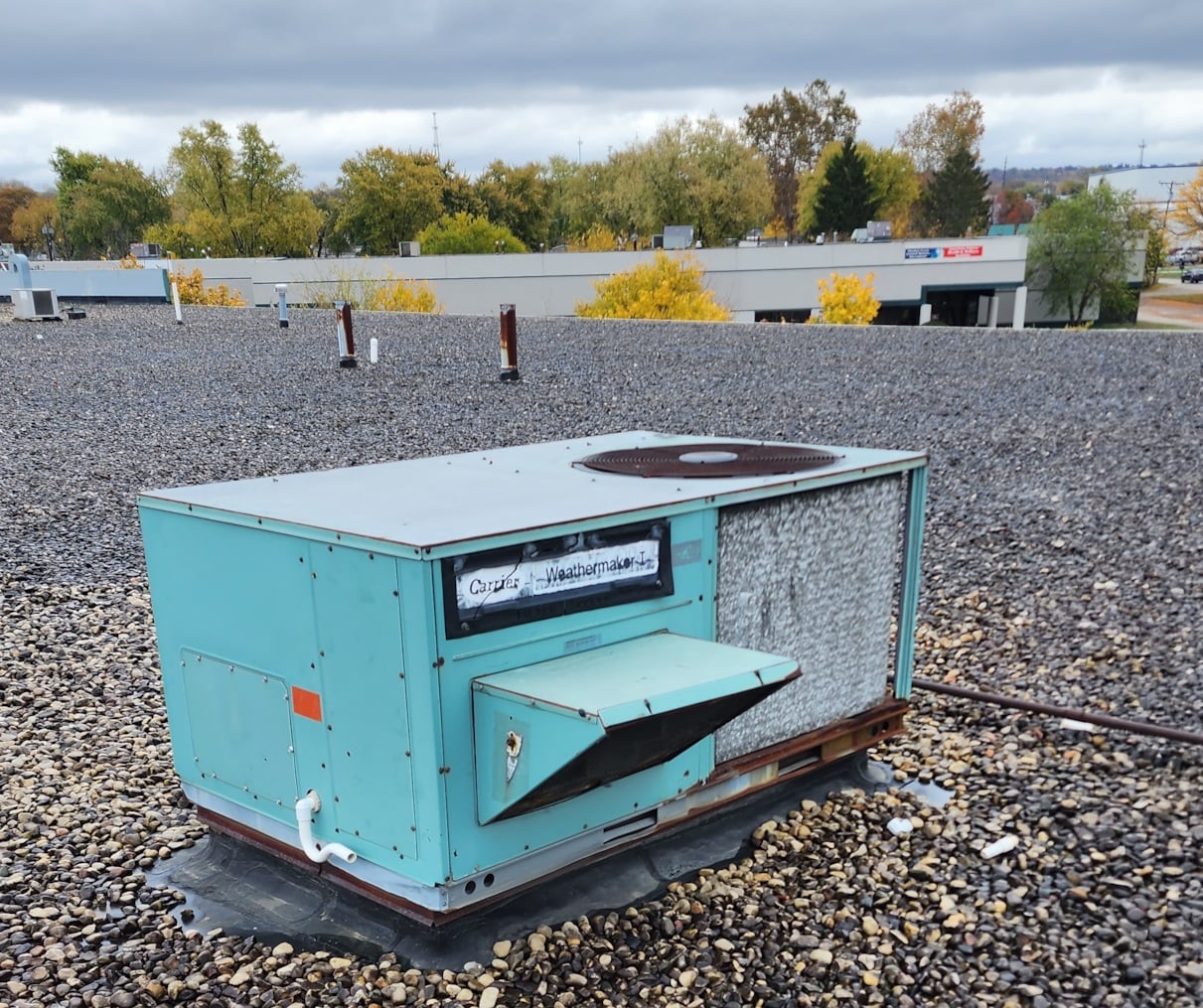 old carrier rooftop air conditioner rtu with hail damage